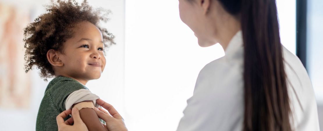 A baby with medical staff